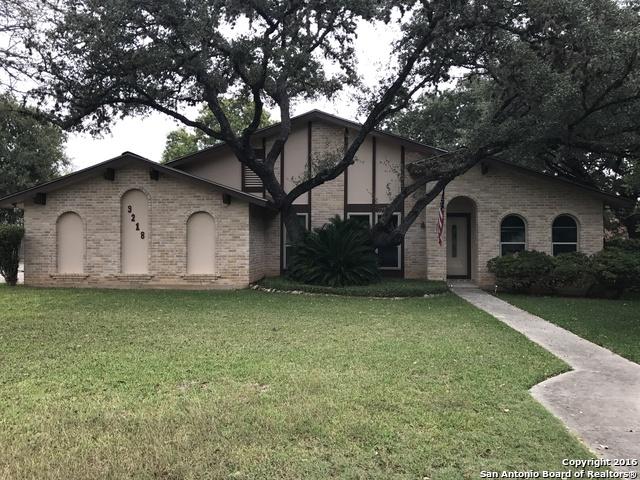 9218 Woodheather, San Antonio, TX 78254 - view of front facade featuring brick siding and a front yard