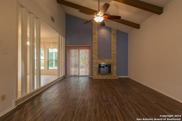 9218 Woodheather, San Antonio, TX 78254 - unfurnished living room with wood finished floors, beam ceiling, a ceiling fan, high vaulted ceiling, and a brick fireplace