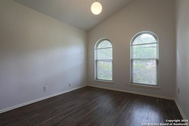 9218 Woodheather, San Antonio, TX 78254 - unfurnished room with dark wood finished floors and high vaulted ceiling