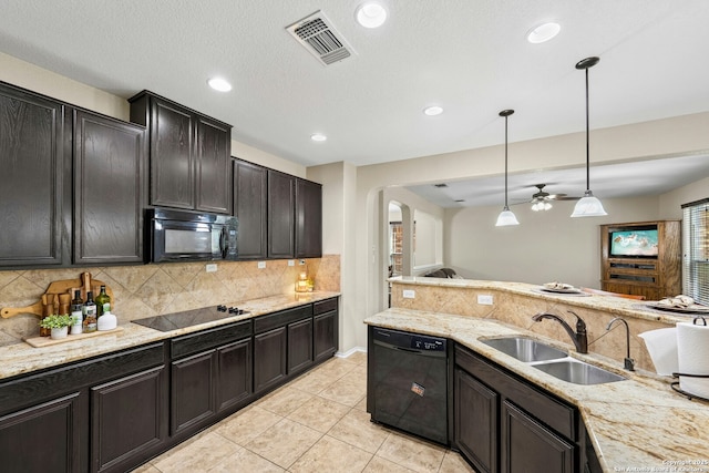 20630 Creek Riv, San Antonio, TX 78259 - kitchen featuring black appliances, arched walkways, tasteful backsplash, ceiling fan, and pendant lighting