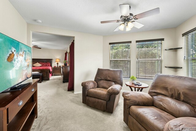 20630 Creek Riv, San Antonio, TX 78259 - carpeted living area with ceiling fan and baseboards