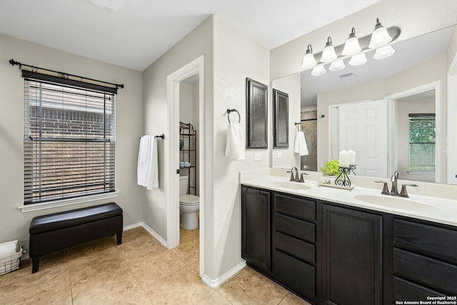 20630 Creek Riv, San Antonio, TX 78259 - bathroom featuring double vanity, plenty of natural light, and tile patterned flooring