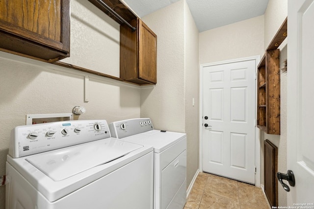 20630 Creek Riv, San Antonio, TX 78259 - laundry room with cabinet space, independent washer and dryer, and a textured wall