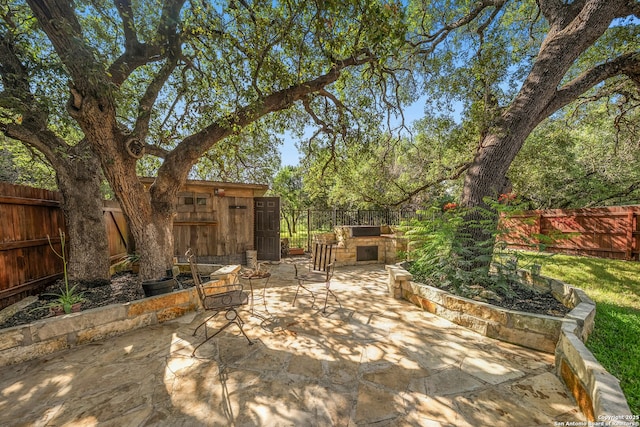 20630 Creek Riv, San Antonio, TX 78259 - fenced backyard with a patio and exterior kitchen
