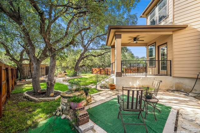 20630 Creek Riv, San Antonio, TX 78259 - fenced backyard featuring a ceiling fan and a patio