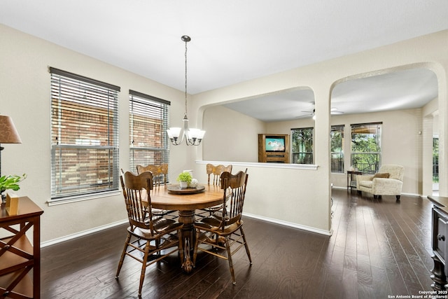 20630 Creek Riv, San Antonio, TX 78259 - dining room with dark wood-style floors, a chandelier, arched walkways, and ceiling fan