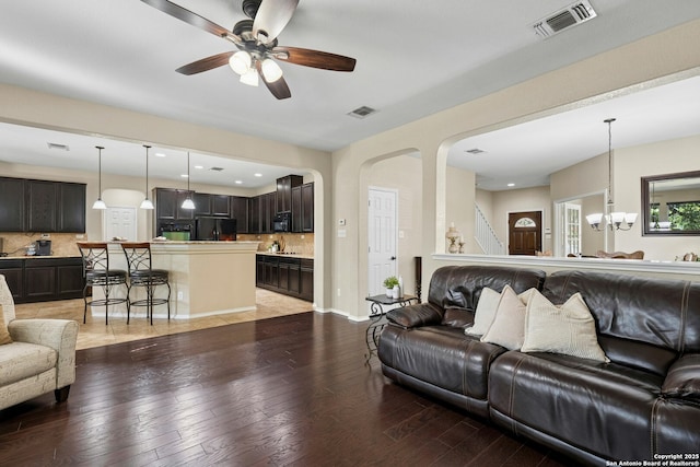 20630 Creek Riv, San Antonio, TX 78259 - living room featuring a ceiling fan, light wood-type flooring, a chandelier, recessed lighting, and stairs