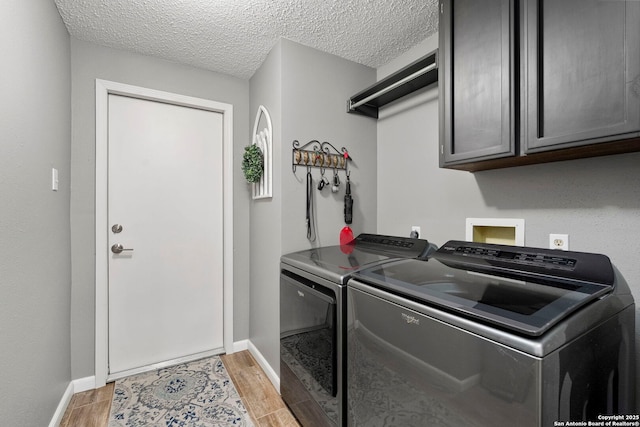 2026 Encino Vista St, San Antonio, TX 78259 - washroom with cabinet space, washer and dryer, and a textured ceiling
