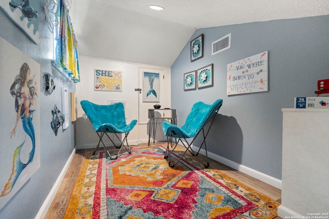 2026 Encino Vista St, San Antonio, TX 78259 - sitting room featuring wood finished floors and vaulted ceiling