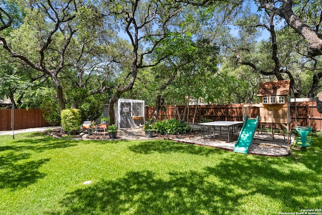 2026 Encino Vista St, San Antonio, TX 78259 - fenced backyard featuring a playground and an outbuilding