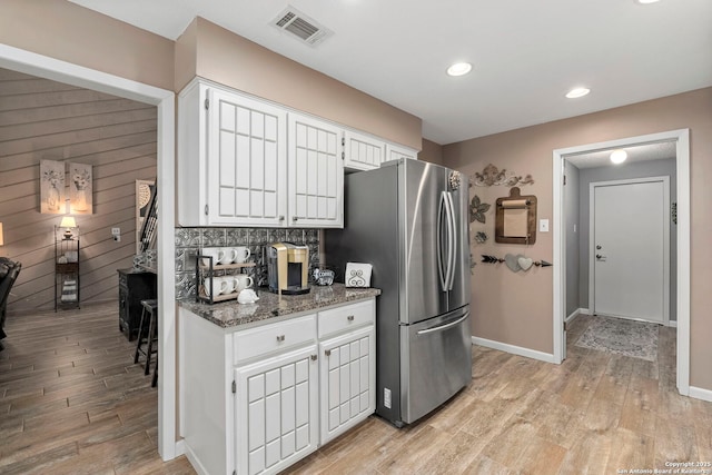 2026 Encino Vista St, San Antonio, TX 78259 - kitchen featuring freestanding refrigerator, light wood-type flooring, white cabinetry, dark stone countertops, and recessed lighting