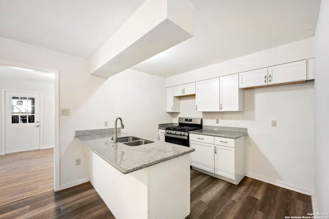 162 Morning Vly, San Antonio, TX 78227 - kitchen with stainless steel gas range oven, a peninsula, dark wood finished floors, and white cabinets