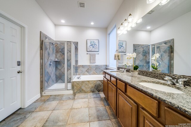 139 Sable Hts, San Antonio, TX 78258 - bathroom with double vanity, a garden tub, a stall shower, and recessed lighting