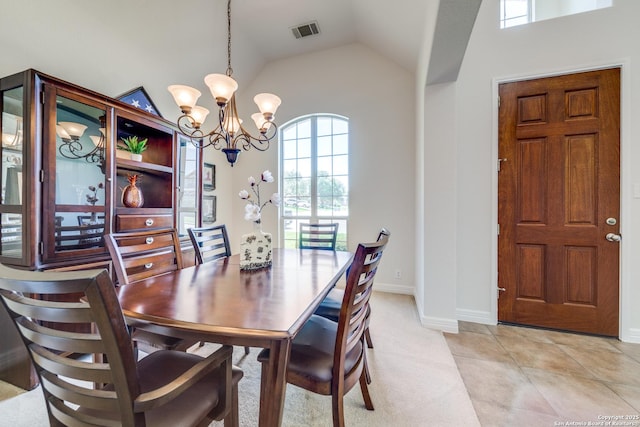 139 Sable Hts, San Antonio, TX 78258 - dining room with a chandelier, vaulted ceiling, and light tile patterned floors
