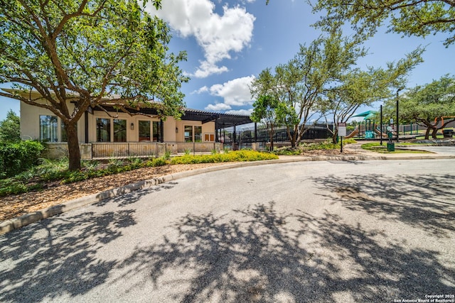 139 Sable Hts, San Antonio, TX 78258 - view of front of property featuring stucco siding and a playground
