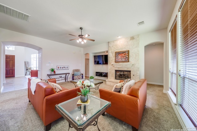 139 Sable Hts, San Antonio, TX 78258 - living area featuring arched walkways, light colored carpet, plenty of natural light, and a ceiling fan