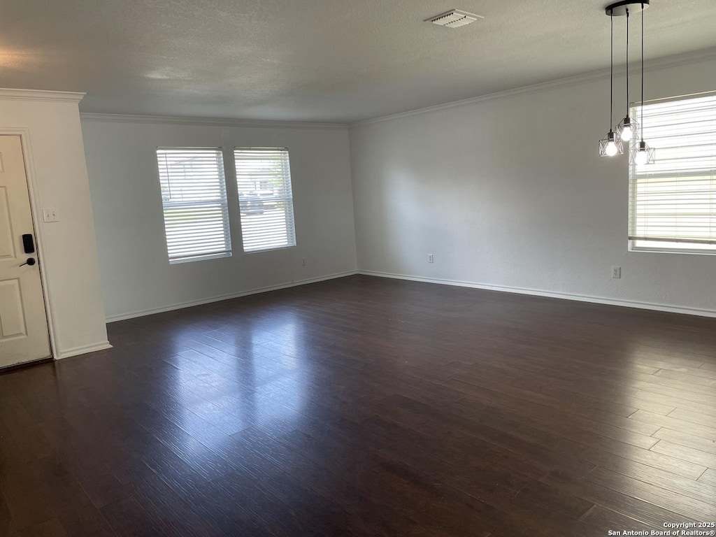 213 Hinge Loop, Cibolo, TX 78108 - empty room featuring crown molding and dark wood finished floors