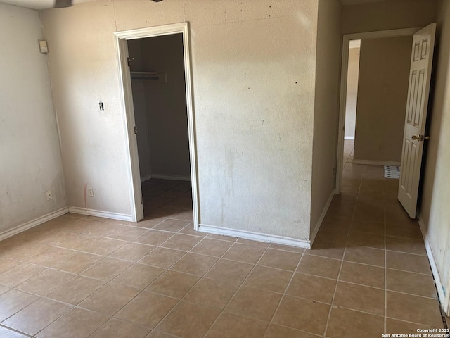 394 Dorie, San Antonio, TX 78220 - unfurnished bedroom with tile patterned floors, a closet, and a spacious closet