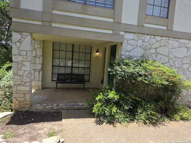 14107 Moss Farm, San Antonio, TX 78231 - view of exterior entry featuring stone siding