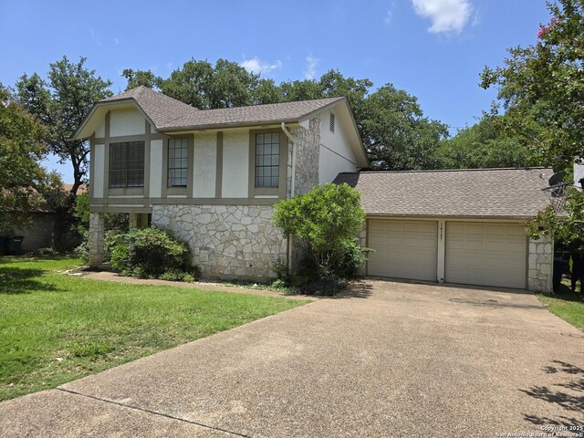 14107 Moss Farm, San Antonio, TX 78231 - english style home with stone siding, driveway, a garage, a front lawn, and a shingled roof