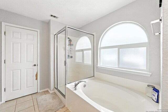 811 Cormorant, San Antonio, TX 78245 - full bath featuring a garden tub, a shower stall, and tile patterned flooring