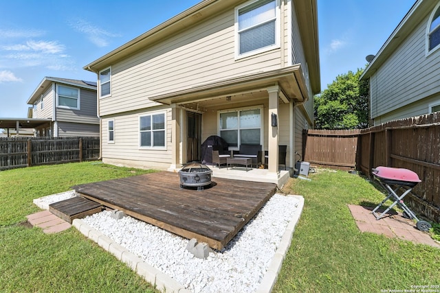 811 Cormorant, San Antonio, TX 78245 - back of property with an outdoor fire pit, a fenced backyard, and a deck