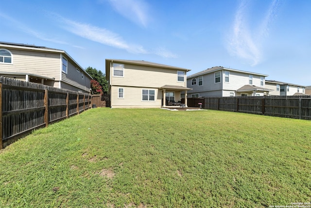 811 Cormorant, San Antonio, TX 78245 - rear view of house with a fenced backyard and a patio area