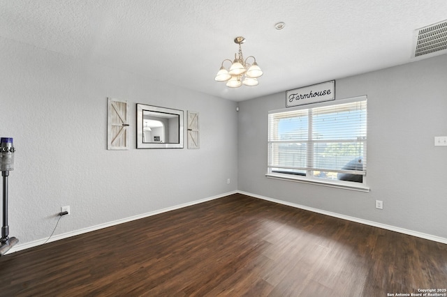 811 Cormorant, San Antonio, TX 78245 - empty room featuring a chandelier and wood finished floors