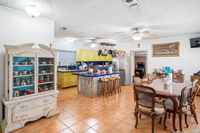 114 Pace Miller, Del Rio, TX 78840 - dining room featuring a ceiling fan, light tile patterned floors, and a textured ceiling