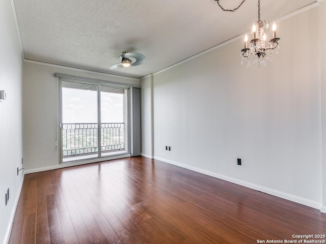 1 Towers Park Unit 1803, San Antonio, TX 78209 - unfurnished room with ornamental molding, a chandelier, dark wood finished floors, and a textured ceiling