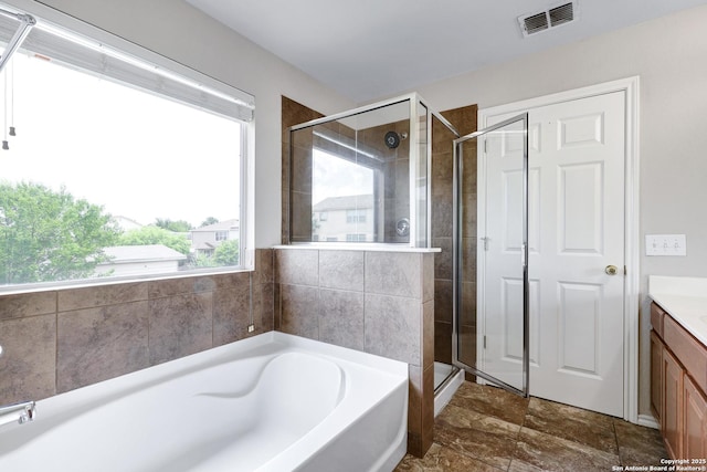 2702 Harvest Crk, San Antonio, TX 78244 - bathroom featuring vanity, a bath, and a shower stall