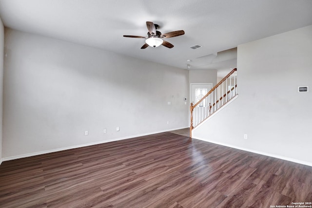 2702 Harvest Crk, San Antonio, TX 78244 - empty room featuring dark wood-type flooring, stairway, and a ceiling fan
