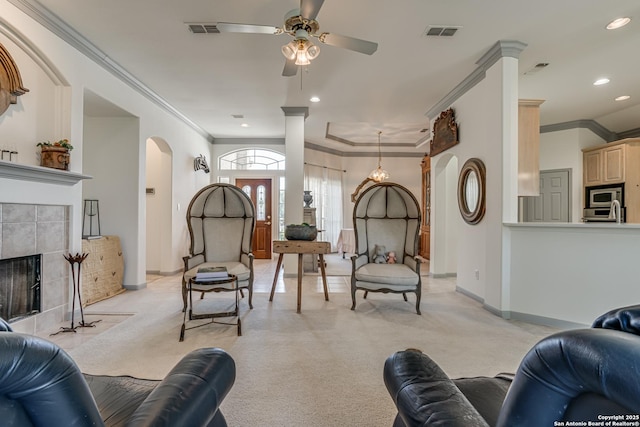 13947 Amber Crst, San Antonio, TX 78249 - living room featuring ornamental molding, light carpet, arched walkways, a ceiling fan, and recessed lighting