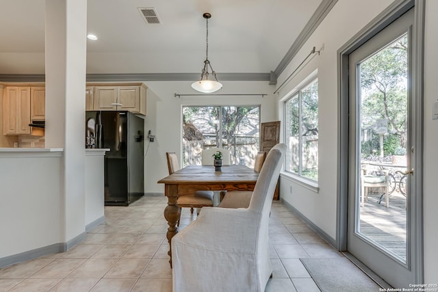 13947 Amber Crst, San Antonio, TX 78249 - dining area with light tile patterned floors and crown molding