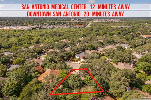 13947 Amber Crst, San Antonio, TX 78249 - aerial view of property and surrounding area with property parcel outlined and a heavily wooded area