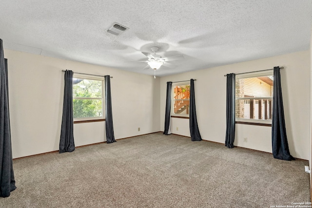 25615 Dull Knife Trl, San Antonio, TX 78255 - spare room featuring carpet floors, a ceiling fan, and a textured ceiling