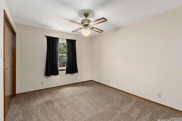 25615 Dull Knife Trl, San Antonio, TX 78255 - unfurnished bedroom with carpet, a textured ceiling, a closet, and a ceiling fan