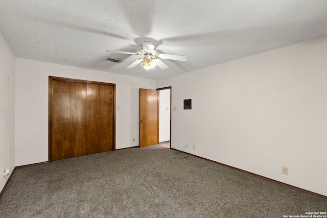 25615 Dull Knife Trl, San Antonio, TX 78255 - unfurnished bedroom with carpet flooring, a closet, ceiling fan, and a textured ceiling