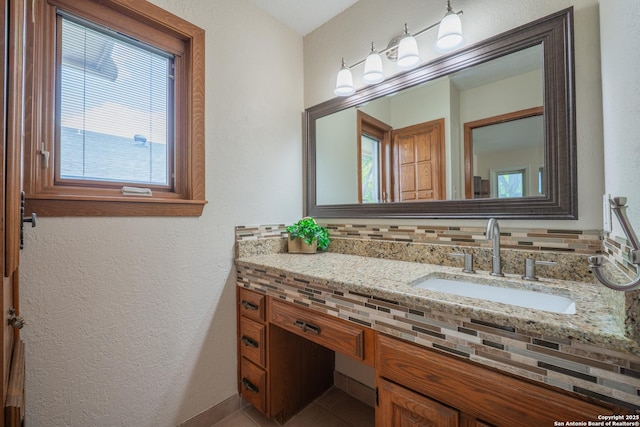 14519 Parksite Woods, San Antonio, TX 78249 - bathroom featuring vanity, a textured wall, and tile patterned floors