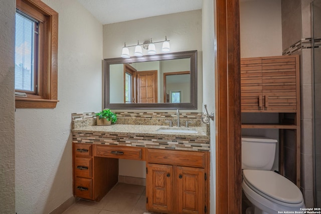 14519 Parksite Woods, San Antonio, TX 78249 - bathroom featuring vanity, tile patterned flooring, and a textured wall