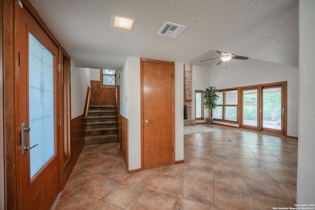 14519 Parksite Woods, San Antonio, TX 78249 - corridor featuring a textured ceiling, stairway, and vaulted ceiling