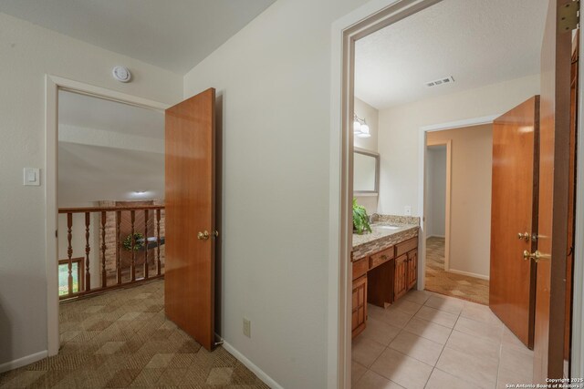 14519 Parksite Woods, San Antonio, TX 78249 - corridor with light carpet and light tile patterned floors