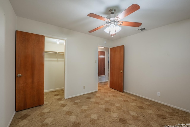 14519 Parksite Woods, San Antonio, TX 78249 - unfurnished bedroom featuring light carpet, a spacious closet, a closet, and ceiling fan
