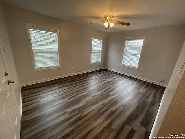 2025 Texas, San Antonio, TX 78228 - spare room featuring dark wood-style flooring, healthy amount of natural light, and ceiling fan