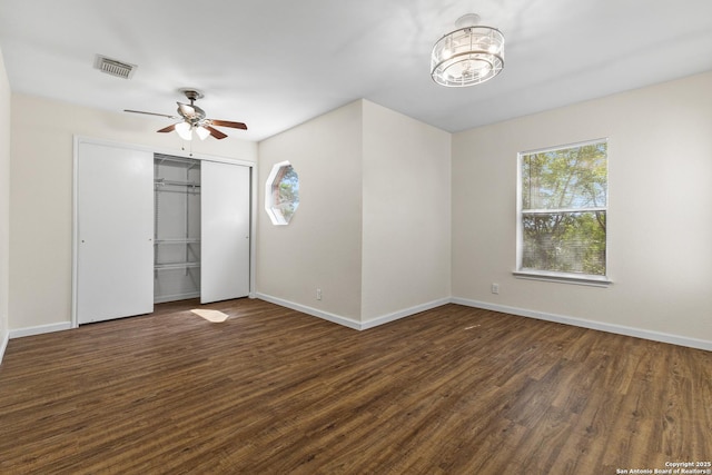 3934 Knollhaven, San Antonio, TX 78247 - unfurnished bedroom featuring wood finished floors, a closet, a ceiling fan, and a chandelier