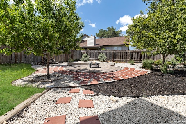 3934 Knollhaven, San Antonio, TX 78247 - fenced backyard with a patio and a fire pit