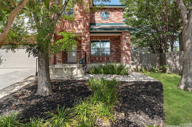 3934 Knollhaven, San Antonio, TX 78247 - view of front of property featuring concrete driveway, covered porch, brick siding, and a garage