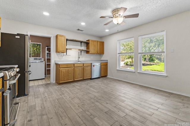 3934 Knollhaven, San Antonio, TX 78247 - kitchen featuring washer / dryer, dishwasher, stove, a ceiling fan, and a textured ceiling