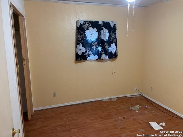 12315 Royal Grn, Conroe, TX 77303 - empty room featuring wood finished floors