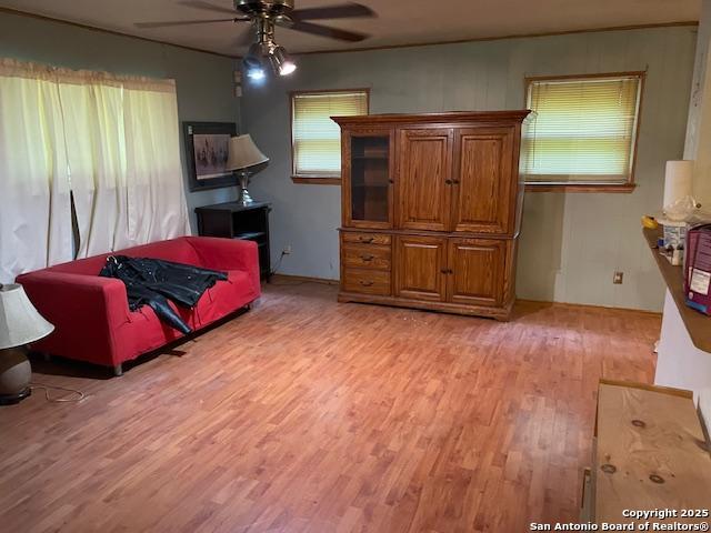 12315 Royal Grn, Conroe, TX 77303 - living room with a ceiling fan and light wood-style floors